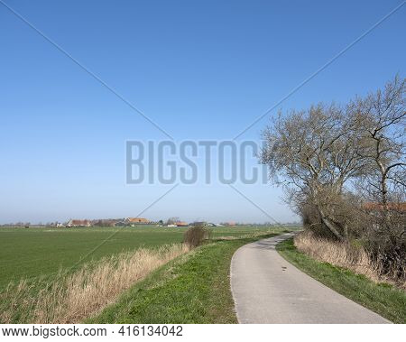 Country Road And Farms On Countryside Of Walcheren Near Middelburg In Dutch Province Of Zeeland In T