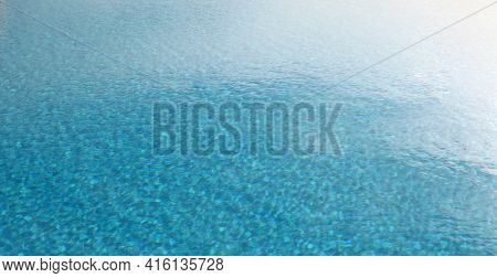 Brur Sky Reflection in water surface. Blue pool horizontal background.