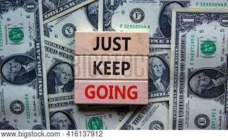 Just Keep Going Symbol. Wooden Blocks With Words 'just Keep Going'. Beautiful Background From Dollar
