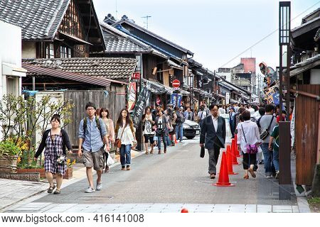Inuyama, Japan - May 3, 2012: People Walk In Inuyama, Japan. Inuyama Is Among Most Important Tourism