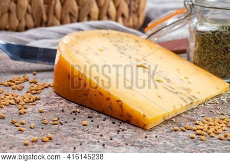 Cheese Collection, Piece Of Hard Yellow Dutch Gouda Cheese With Dried Caraway Or Cumin Seeds