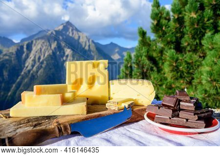 Cheese Collection, French Beaufort, Abondance, Emmental, Tomme De Savoie Cheeses Served Outdoor In S