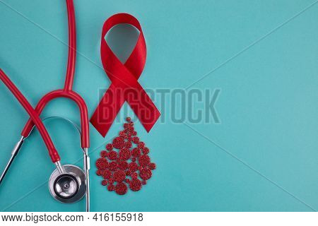 Awareness Oncept With Blood Drop And Red Ribbon. World Hamophilia Day Or Blood Donor Day