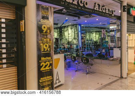 Madrid, Spain - August 6, 2018 - Hairdresser While Working In Herrera Oria District Of Madrid