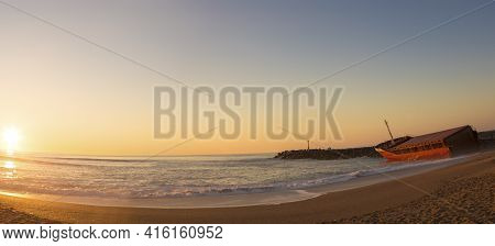 Anglet, France, March 9: Panorama Of The Atlantic Ocean And The  Sunset With Shipwreck On The Beach 