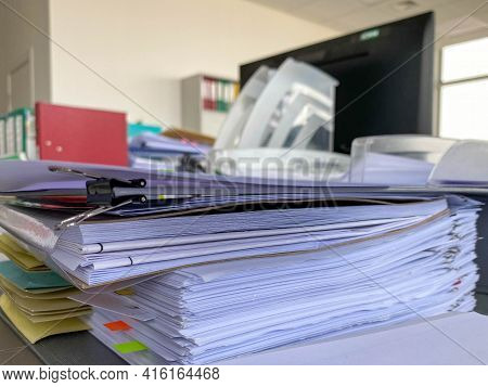 Stack Of Papers Documents In Archives Files With Clip Papers On Table At Offices, Busy Offices And P