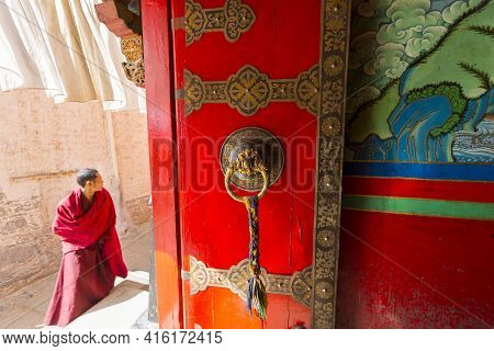 Shigatse, China, April 18: Close Up Of Antique Wooden Colored Door Inside A Tibetan Temple At Shigat