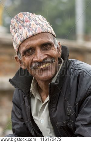 Kathmandu, Nepal, April 22: Nepalese Portrait Senior Man Smiling To The Camera And Wearing A Nepales