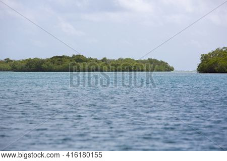 View Of The Cayo And The Ocean Against A Blue Sky In Morrocoy National Park, Venezuela.