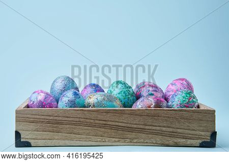 Colorful Painted Eggs With Bright Shiny Gliter In Wooden Box