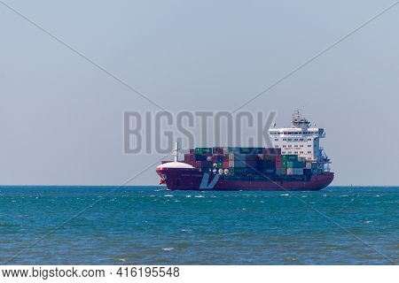 Portugal, Lisbon, October 08, 2018: Container Ship Sailing In To The Seaport.