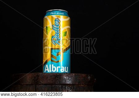 Can Of Albrau Radler Beer On Beer Barrel With Dark Background. Illustrative Editorial Photo Shot In 