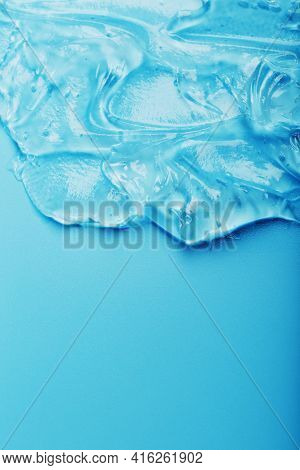 Antiseptic Gel On A Blue Background In Waves.