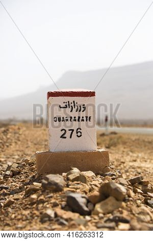Ouarzazate 276 Kilometres - Road Sign Distance Indicator On The Road To Ouarzazate With Blurred Back