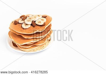 Pancake With Bananas On A Plate, On A White Background, Isolated, With A Place For Text