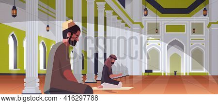 Religious Muslim Men Couple Kneeling And Praying Inside Nabawi Mosque Building Ramadan Kareem Holy M