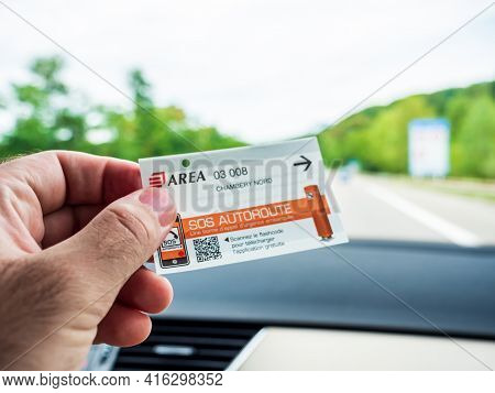 Chambery, France - Aug 15, 2017: Male Hand Holding Inside Car Ticket Of Toll Road Operated By Area I
