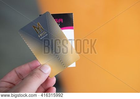 Bangkok, Thailand - April 10, 2021 : Man Hand Holding A Member Card, M Pass Regular And Movie Ticket