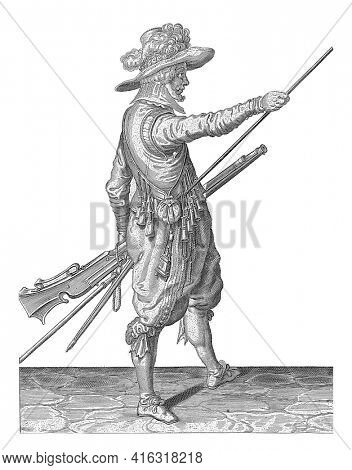 Soldier with a musket sliding his right hand to the end of his ramrod, vintage engraving.