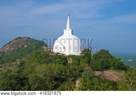 View Of The Ancient Stupa Of Mahaseya Dagoba Against The Background Of The Blue Sky In The Sunny Mor