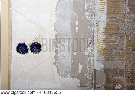 Electrical Wire And Opened Junction Box On Don\\\'t Plastered Wall. Home Renovation Concept