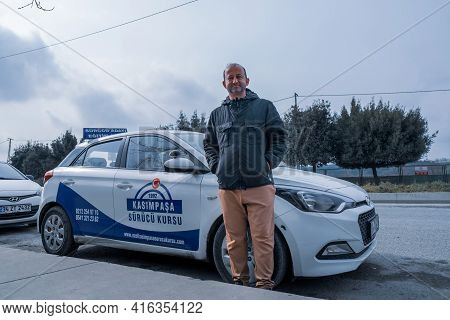 Kemerburgaz, Istanbul, Turkey - 03.19.2021: One Male Instructor Of Driving Test Car In Turkey Standi