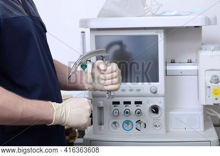 Laryngoscope In Hands Of An Anesthesiologist. Tracheal Intubation. Preparation Of Equipment For Surg