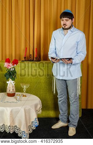 Before The Chuppah Ceremony, The Jewish Groom Reads Siddur Prayers In The Synagogue.