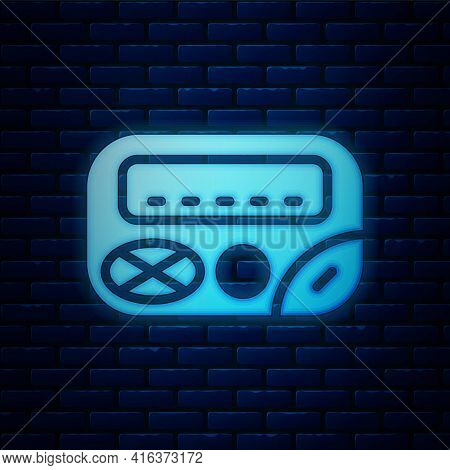 Glowing Neon Pager Icon Isolated On Brick Wall Background. Vintage 1990s Electronics Messenger. Vect