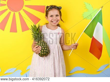 Little Girl On A Bright Background With Italian Flag. The Concept Of Summer, Beach Holidays And Vaca