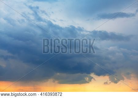 Blue Clouds With Slight Rain In The Evening Light