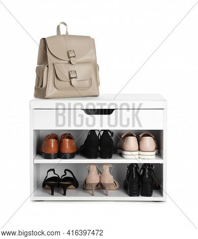 Stylish Storage Cabinet With Different Pairs Of Shoes And Backpack On White Background