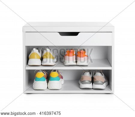 Stylish Storage Cabinet With Different Pairs Of Shoes On White Background