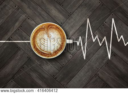 A Cup Of Coffee Is On A Gray Wooden Board With A Heart Chart.