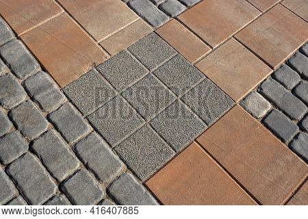 Texture Of Gray And Brown Paving Slabs On The Street, Perspective View. Cement Brick Square Stone Fl