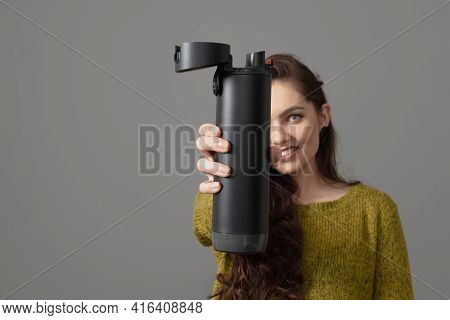 Woman Holding Eco Reusable Smart Thermo Water Bottle With Drink Reminder, Healthy Lifestyle Concept
