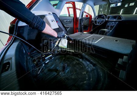 A Car Service Worker Cleans Interiror With A Special Foam Generator