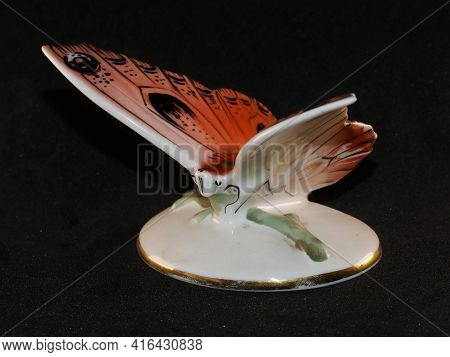 Porcelain Butterfly Figurine Isolated On Black Background