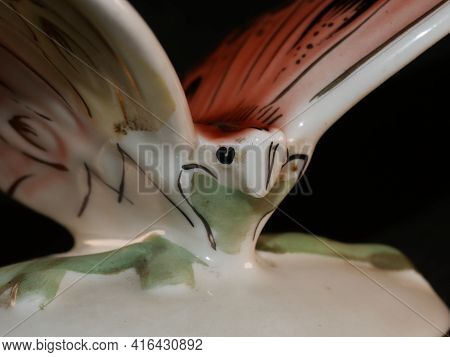 Porcelain Butterfly Figurine Isolated On Black Background