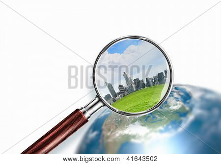 planeta mini conceptual con una ciudad en él
