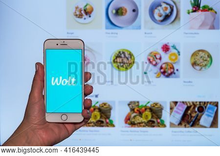 Thessaloniki, Greece - April 10 2021: Wolt Food Delivery Order Concept. Female Hand Holds Before Scr