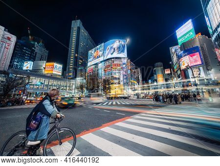 Tokyo - 27 March 2019 - Electrifying Shibuya Crossing At Night With Neon Signs And Night Life And Mo