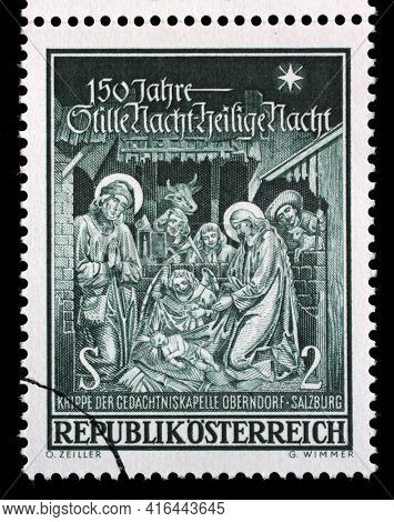 ZAGREB, CROATIA - SEPTEMBER 09, 2014: Stamp printed in Austria shows Crib of the memorial chapel Oberndorf-Salzburg, circa 1968.