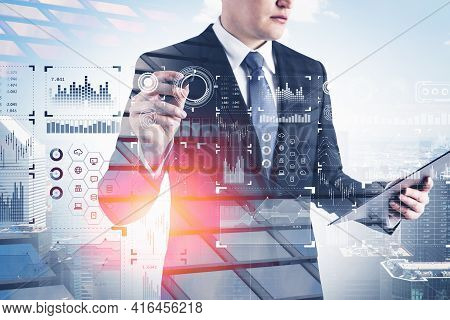 Seious Businessman Wearing Formal Suit Is Touching Digital Interface Screen With Penr And Holding A 