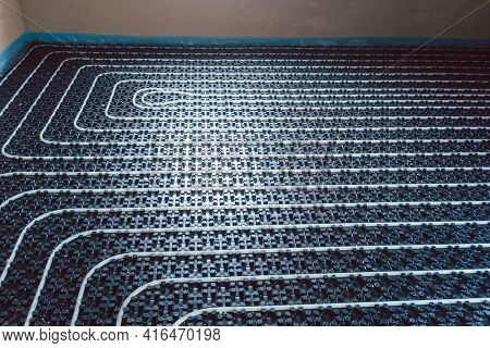 Pipes for underfloor heating ready to be covered with grout