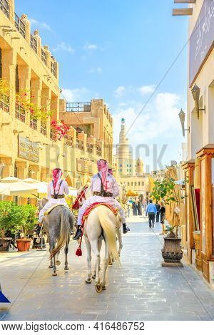 Doha, Qatar - February 20, 2019: Heritage Police Officers In Traditional Qatari Uniform At Old Souq 