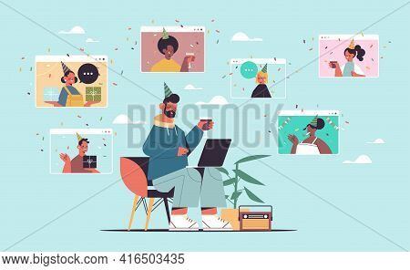 Man In Festive Hat Using Laptop Celebrating Online Birthday Party With Mix Race Friends In Computer 