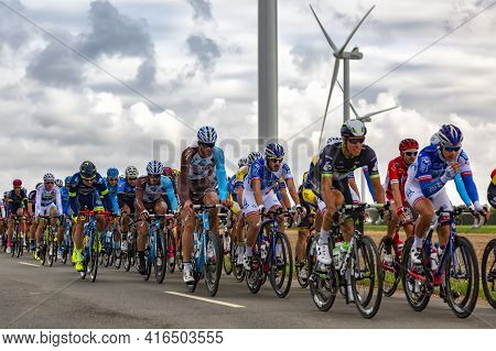 Le Gault-saint-denis, France - October 08, 2017: The Peloton Riding On A Road In The Plain With Wind