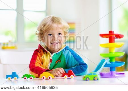 Boy Playing Toy Cars. Kid With Toys. Child And Car
