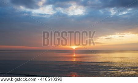 Beautiful Sunset Over The Clam Sea With Cloud Sky Background. Sunset Over Tropical Beach. Nature Sum